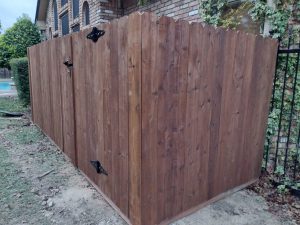 Photo of a stained stockade wood fence